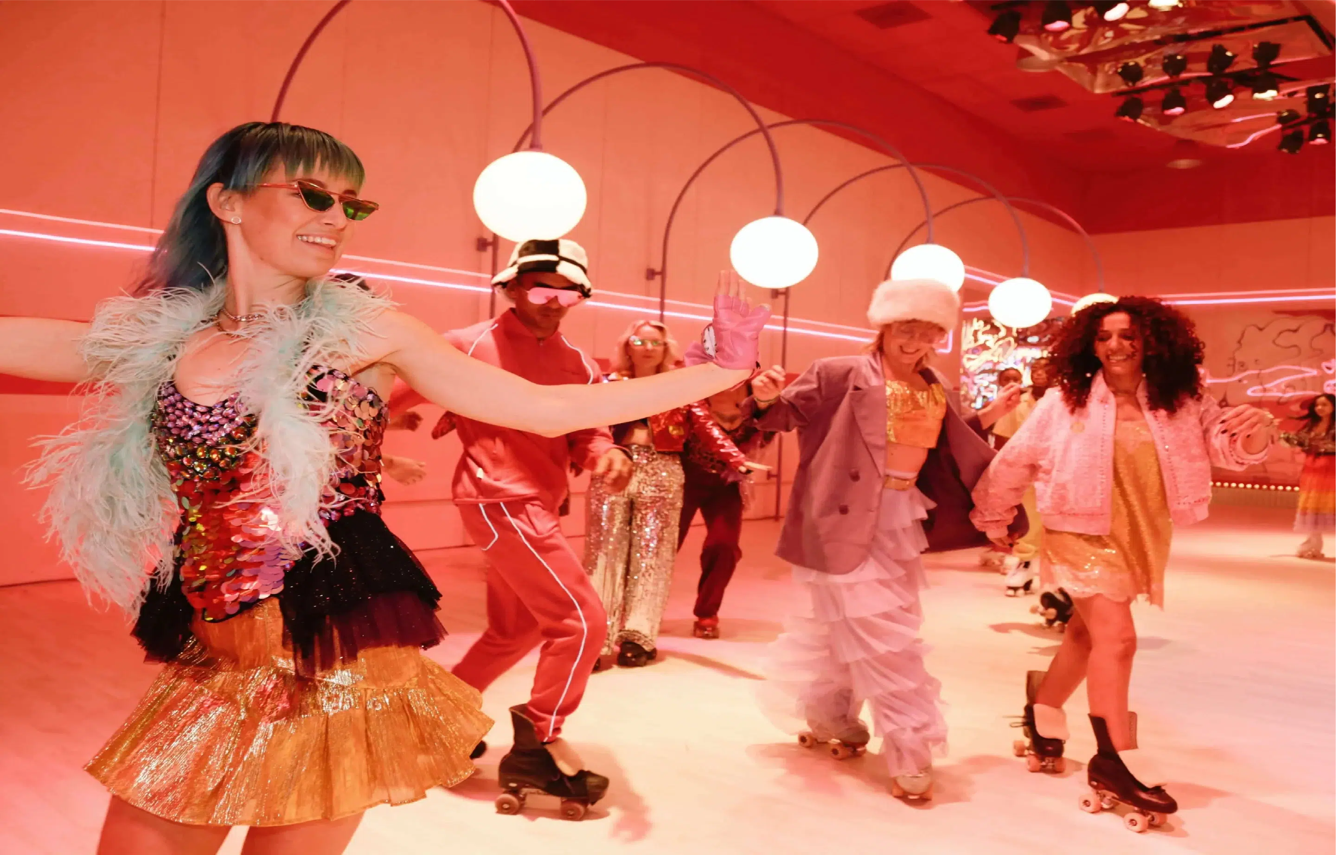 Group skating in a colorful roller disco room at Wondr