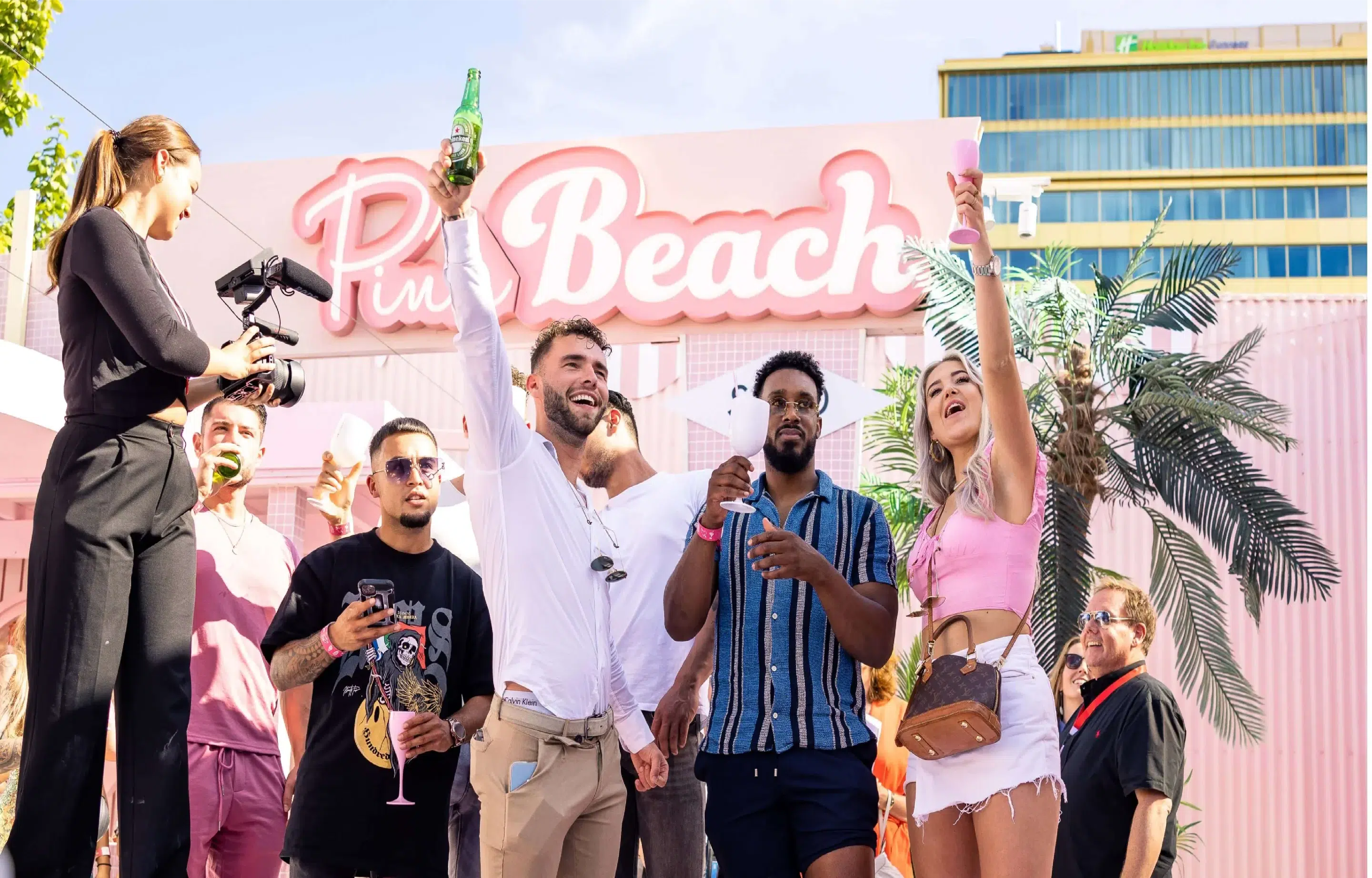 people celebrating at the pink beach WONDR experience event