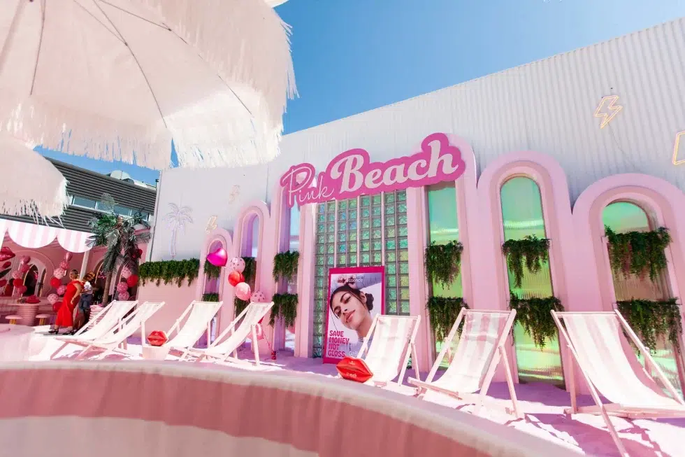Pink Beach outdoor lounge area with deckchairs umbrellas and pastel decor